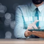 man in suit with ipad
